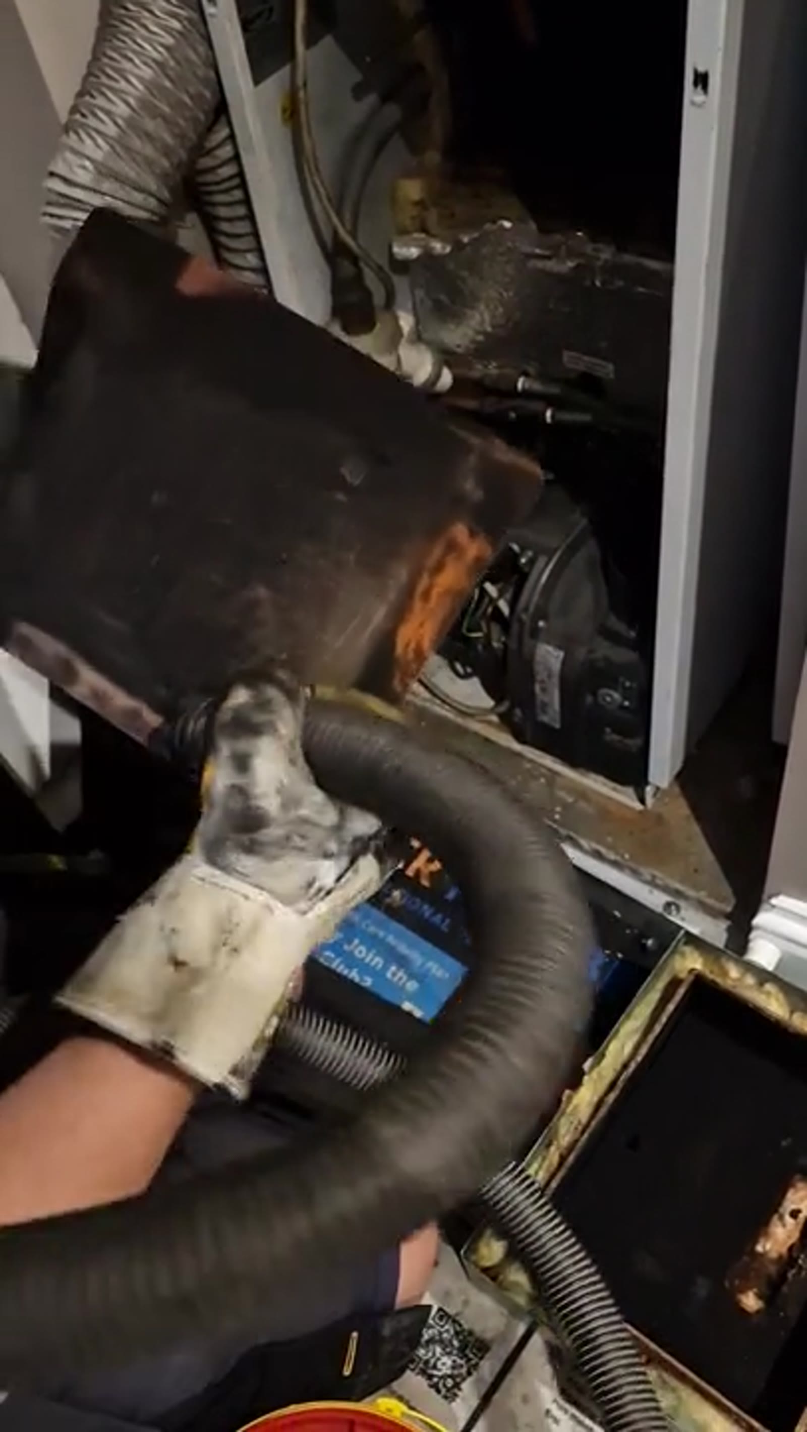 Alex from PCR Plumbers cleaning the MagnaClean filter during a Grant oil boiler repair and service in Wistow