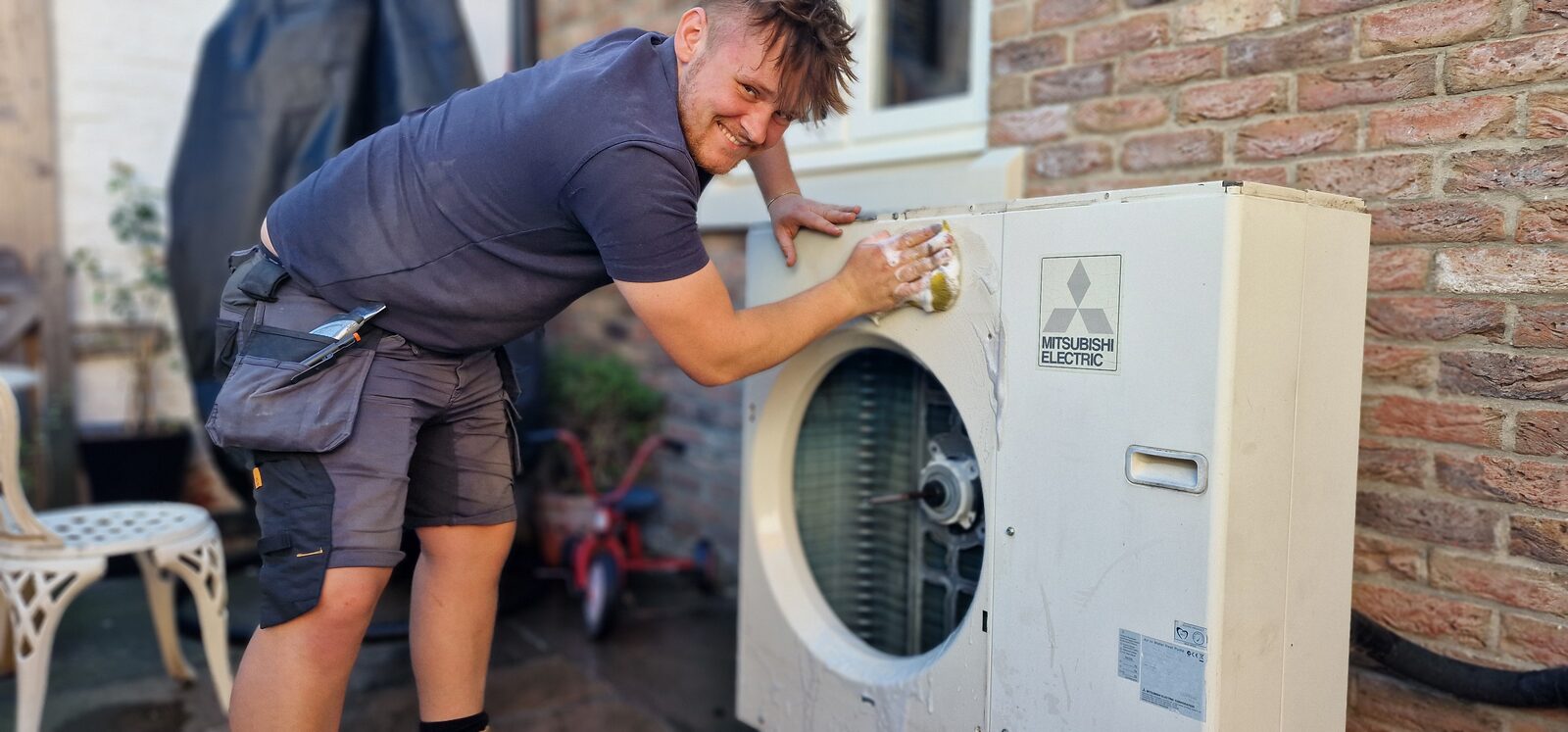 Alex from PCR servicing Wayne Radcliffe’s Mitsubishi Ecodan air-source heat pump in Stillingfleet